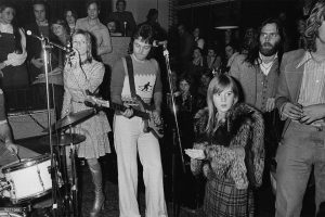 Tigrett terrified - right - seconds after IRA phone bomb scare, while Beatle Paul McCartney premieres new band WINGS at HRC London, 1972